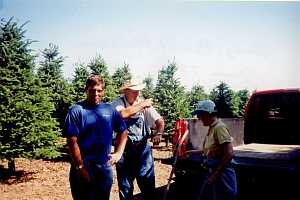 Balsam fir mountain in background. In foreground Left to right (Andy Asack, Bill Asack, Kathleen Modine)